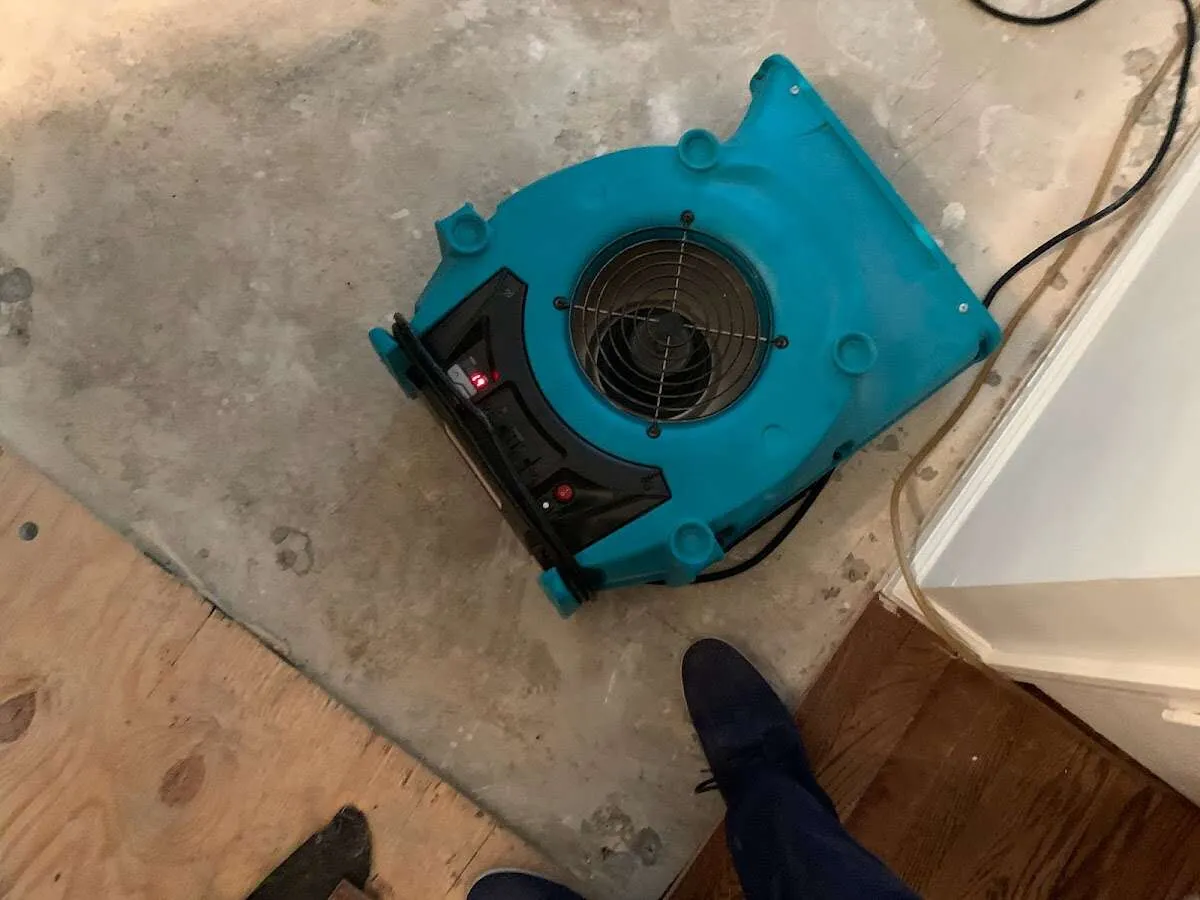 Air mover drying subfloor during Commercial Water Damage Restoration in Los Altos
